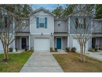 Gray townhouses with teal doors and white garages at 275 Jackson St, Goose Creek, SC 29445