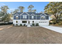 House front view, landscaping, driveway at 970 Lansing Dr, Mount Pleasant, SC 29464