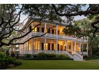 Two story home with wrap around porch and mature landscaping at 1750 Ion Ave, Sullivans Island, SC 29482