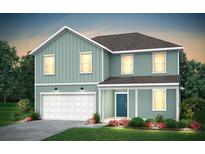 Two-story house with light green siding, white garage door, and landscaping at 225 W West Bradford Pointe Dr, Summerville, SC 29483