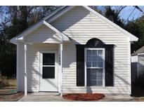 Charming one-story home with white siding and black shutters at 4863 Lecque St, North Charleston, SC 29405