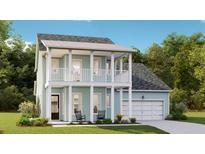 Two-story light blue house with white accents, balcony, and two-car garage at 199 Denham St, Summerville, SC 29486