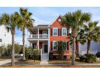 Two-story home with a charming front porch and lush landscaping at 2274 Sandy Point Ln, Mount Pleasant, SC 29466