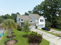 Two-story home with gray siding, brick accents, and a two-car garage at 2670 Lamina Ct, Mount Pleasant, SC 29466