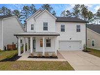 Two-story white house with gray roof, front porch, and attached garage at 530 Richfield Way, Summerville, SC 29486