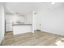 Modern white kitchen with wood countertops and stainless steel appliances at 130 River Landing Dr # 7116, Charleston, SC 29492