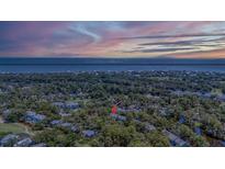 Aerial view of coastal community showing home location, pool, and golf course at 477 Sea Cloud Cir, Edisto Island, SC 29438