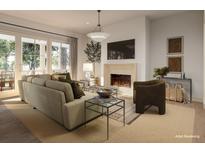 Bright living room features a fireplace, comfy seating, and large windows at 515 Helmsman St # 515, Daniel Island, SC 29492
