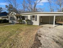 Charming single story home with carport and well-maintained lawn at 1104 Berkeley St, Hanahan, SC 29410