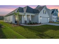 Two-story Craftsman home with a covered porch and attached two-car garage at 115 Crosscut Ln, Summerville, SC 29486