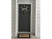 Inviting front door with a welcome wreath and mat at 1300 Park West Blvd # 110, Mount Pleasant, SC 29466