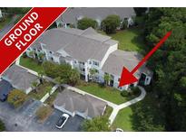 Aerial view of a ground floor apartment building with surrounding landscape at 1300 Park West Blvd # 217, Mount Pleasant, SC 29466