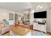 Bright living room with comfy seating, large TV, and access to a balcony at 149 High Hammock Villas, Seabrook Island, SC 29455