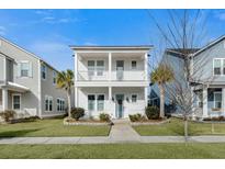 Two-story house with white siding, front porch, and landscaping at 212 Magnolia Garden Dr, Summerville, SC 29483