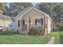Charming craftsman style home with a welcoming front porch at 5518 Garrett Ave, North Charleston, SC 29406