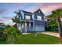 Two-story home with blue siding, white trim, and a landscaped lawn at 1251 Weather Helm Dr, Mount Pleasant, SC 29466