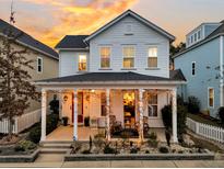 Charming 2-story home with a welcoming front porch and landscaped yard at 2021 Codorus Ln, Hanahan, SC 29410