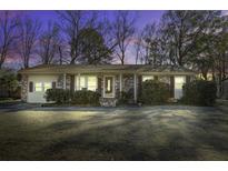 Brick ranch house with a well-manicured lawn at 303 Holly Avenue Ave, Goose Creek, SC 29445