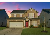 Two-story house with brick and siding, a double-car garage, and a manicured lawn at 394 Sanctuary Park Dr, Summerville, SC 29486