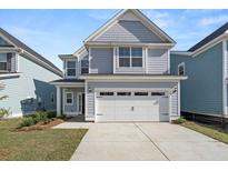 Two-story home with gray siding, white trim, and a two-car garage at 769 Opal Wing St, Moncks Corner, SC 29461