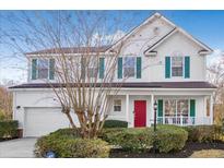 Two story house with white siding, red door, and green shutters at 1014 Ariel Ct, Summerville, SC 29485