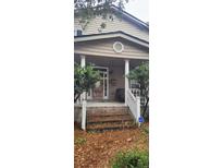 Two-story house with front porch and steps at 1150 King St, Charleston, SC 29403