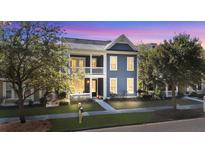 Two-story house with blue siding, white trim, and a front porch at 155 Village Ponds Dr, Summerville, SC 29483