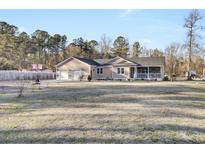 Ranch home with 3-car garage, large yard, and basketball court at 320 Harry Ln, Moncks Corner, SC 29461