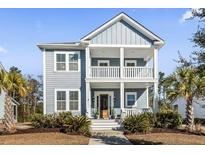 Two-story home with gray siding, white trim, and a front porch at 3913 Maidstone Dr, Mount Pleasant, SC 29466