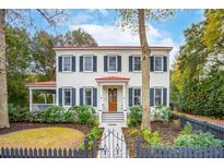 Two-story home with white siding, red roof, and black shutters at 305 N Civitas St, Mount Pleasant, SC 29464