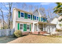 Two-story house with green shutters, brick accents, and a two-car garage at 174 Winding Rock Rd, Goose Creek, SC 29445
