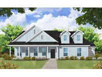 Charming craftsman style home with light blue siding, and a covered porch at 1961 Central Ave, Summerville, SC 29483