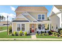 Charming 2-story house with a welcoming front porch and landscaped yard at 203 Oak View Way, Summerville, SC 29483