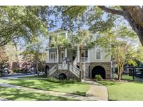 Two-story house with a large front porch and landscaped yard at 400 Bay Crossing Rd, Mount Pleasant, SC 29464