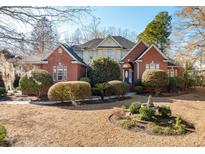 Brick home with landscaped yard and fountain at 4245 Club Course Dr, North Charleston, SC 29420