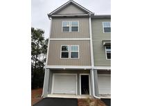 Two-story townhome with attached garage and neutral exterior at 107 Aplomb Alley # 13, Charleston, SC 29414