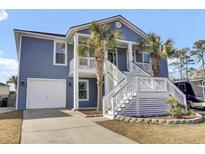 Two-story house with gray siding, white trim, and a large front porch at 1201 Roma Rd, Hanahan, SC 29410