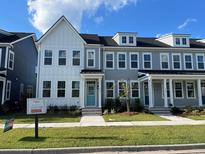 Two-story townhouses with gray siding and white accents at 191 Blueway Ave, Summerville, SC 29486