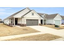 Craftsman style home with a two-car garage and brick accents at 333 Dahlia Row Dr, Summerville, SC 29486