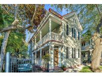 Charming two-story home with a metal roof and gated entry at 34 Warren St, Charleston, SC 29403