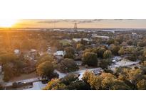 Aerial view of houses nestled amongst trees, near a bridge and body of water at 434 Shannon Dr, Mount Pleasant, SC 29464