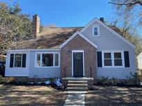 Charming renovated home with brick accents and updated siding at 5730 Hoover Ave, Hanahan, SC 29410