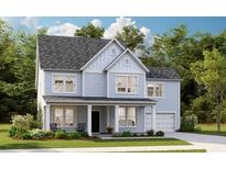 Two-story light blue house with gray roof, front porch, and landscaping at 576 Richfield Way, Summerville, SC 29486