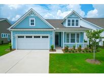 Charming light blue house with white garage and landscaped lawn at 105 Waxwing Dr, Summerville, SC 29483