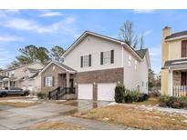 Two-story house with brick and siding, two-car garage, and a well-maintained lawn at 1626 Seloris Ct, Charleston, SC 29407