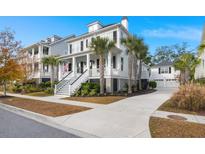 Two-story home with white siding, black shutters, and a front porch at 1910 Bellona St, Charleston, SC 29492