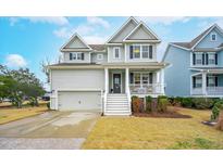 Two-story house with gray siding, white trim, and a front porch at 2186 Midden Dr, Mount Pleasant, SC 29466
