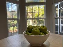 Bright dining room with hardwood floors and a farmhouse table at 3100 Sonja Way, Mount Pleasant, SC 29466