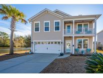 Two-story house with a two-car garage and water view at 3157 Timberline Dr, Johns Island, SC 29455