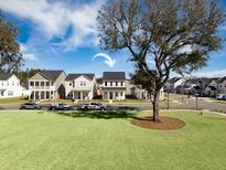 Two-story house in a neighborhood with a grassy yard at 117 Wonder Sol Way, Summerville, SC 29485